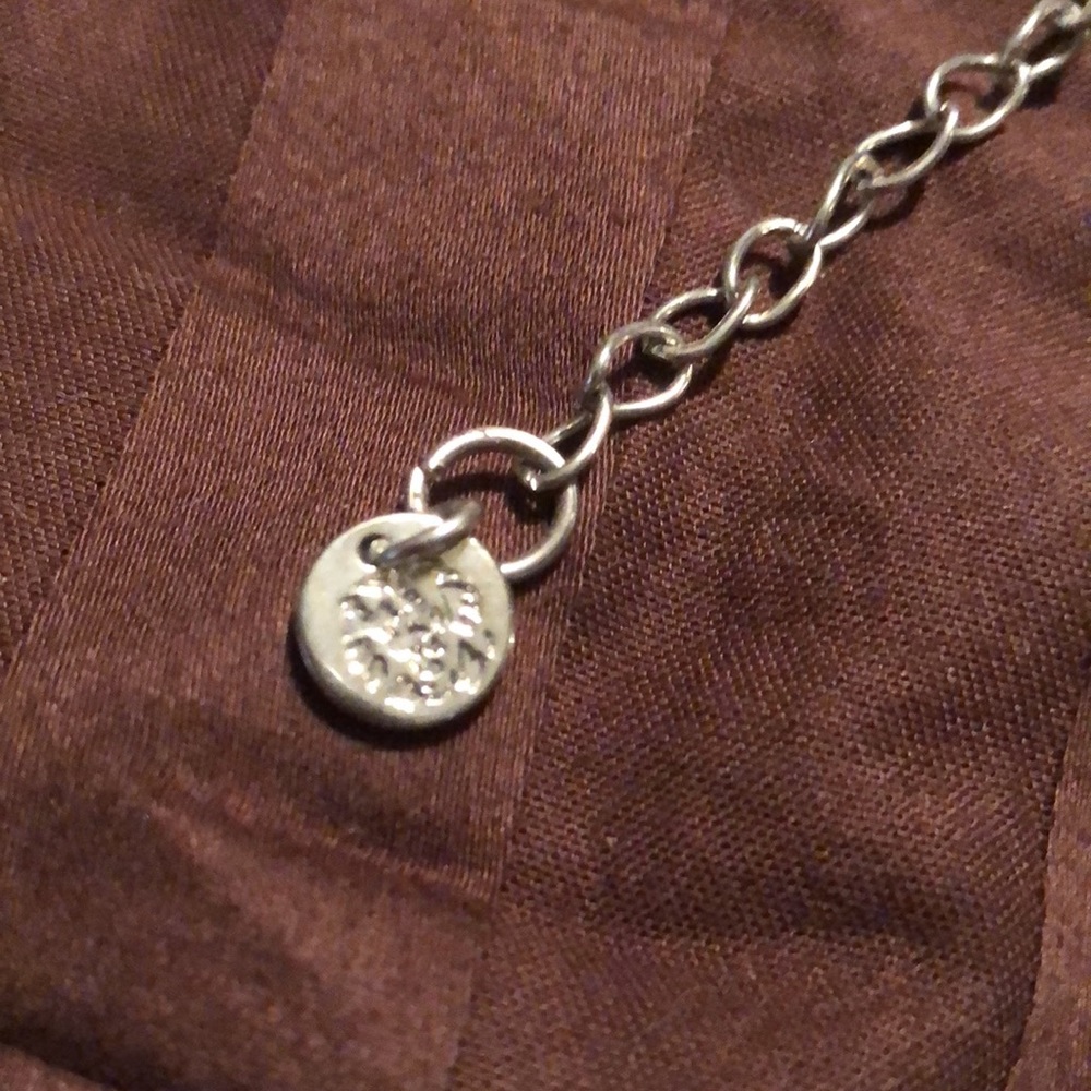 Jennifer Lopez. Silver tone necklace, possibly a belt. - Picture 3 of 5